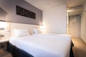 Postel nebo postele na pokoji v ubytování ibis Styles Strasbourg Nord Palais des Congrès