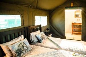 Krevet ili kreveti u jedinici u okviru objekta Ozondjou Trails