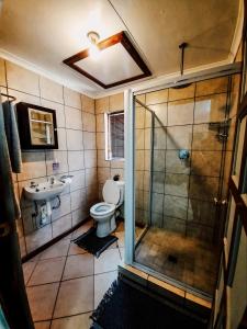 Ein Badezimmer in der Unterkunft Woodii Guest House