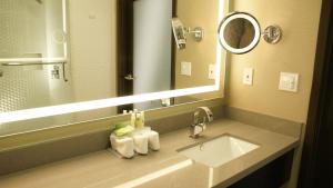 a bathroom with a sink and a mirror at Holiday Inn Express Hollywood Walk of Fame by IHG in Los Angeles