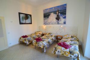 a living room with couches and chairs in a room at La Marina in Ancona