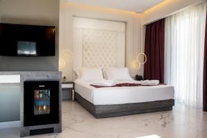 Posteľ alebo postele v izbe v ubytovaní Lagaria Hotel
