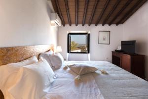 Postel nebo postele na pokoji v ubytování Estalagem de Monsaraz