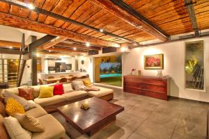 a living room with a couch and a coffee table at Maison avec piscine et jardin- 4 chambres 8 pers in Cuers