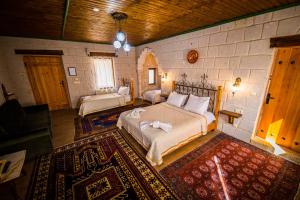 a bedroom with a large bed in a room at Angel Cave Suite in Goreme