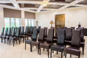a room with a bunch of chairs in a room at Park Rost Club in Zadonetskoye +57 photos