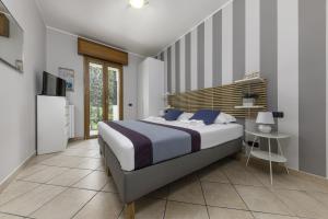 Cama o camas de una habitación en Casa da Suite Ambiziosa