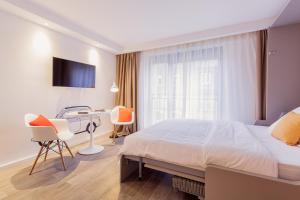 360 Apartment Hotel Frankfurt房間的床