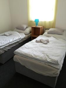Tempat tidur dalam kamar di Vendégház Kalocsa