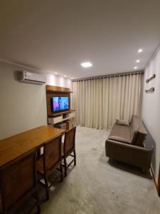 TV a/nebo společenská místnost v ubytování Taipu Beach House - Barra Grande