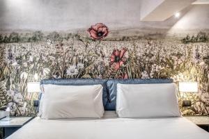 A bed or beds in a room at PAX hotel