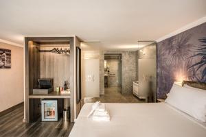 A bed or beds in a room at PAX hotel