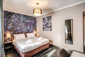 A bed or beds in a room at PAX hotel