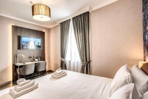 A bed or beds in a room at PAX hotel