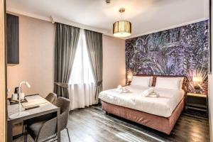 A bed or beds in a room at PAX hotel