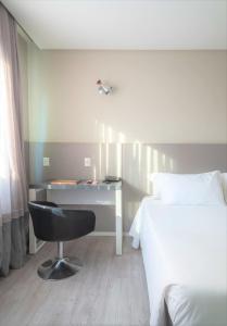 Postel nebo postele na pokoji v ubytování Hotel Melo