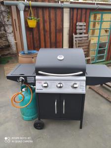 a bbq grill sitting on a patio at Chata Dvorečná in Loučovice