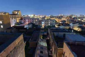 a view of a city at night with buildings at Pigneto Life Nest in Rome