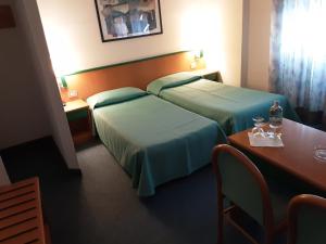 Postel nebo postele na pokoji v ubytování Hotel Ramoverde