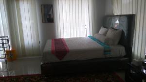 Cama o camas de una habitación en OMA Homestay