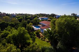 an aerial view of a house in the trees at Casa Fortuna in Lagos