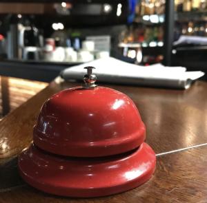 a red object sitting on top of a table at Hotel Carneval in Suonenjoki