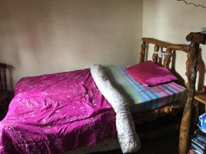 Łóżko lub łóżka w pokoju w obiekcie Mai Kilimanjaro Home Stay