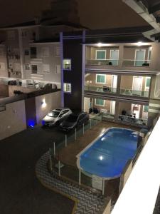 an aerial view of a building with a swimming pool at Residencial Flat Debora in Florianópolis
