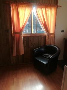 Posezení v ubytování Cabañas Tu Bosque