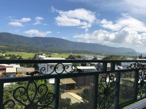 a view of the mountains from a balcony at Chishang Music Guesthouse in Chishang