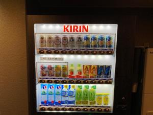 a refrigerator filled with different types of drinks at APA Hotel Nambaminami Ebisucho Eki Shinsekai in Osaka