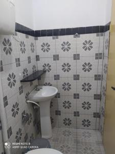 a bathroom with a sink and a toilet at Pousada Do Sol in Parnaíba +40 photos