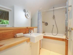 a bathroom with a sink and a shower at Hole Farm in Gidleigh +33 photos