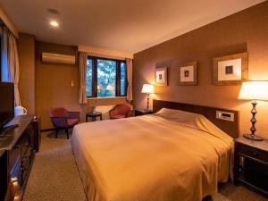 Apikogen Mori no Hotel客房内的一张或多张床位