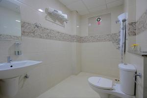 Koupelna v ubytování ABM Express Inn