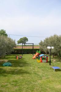 a park with a bunch of playground equipment in the grass at Endless View in Mesimvría