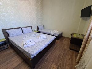 Cama o camas de una habitación en Гостевой дом Звёздный