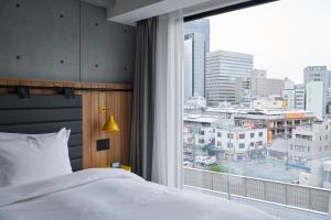 ibis Styles Nagoya房間的床