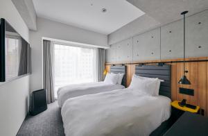 ibis Styles Nagoya房間的床