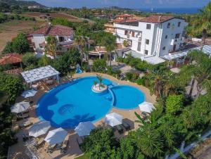 an overhead view of a swimming pool at a resort at La Bussola Hotel Calabria in Capo Vaticano