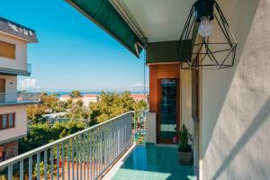 a balcony with a view of the ocean at Sorrento City Apartment in Sorrento