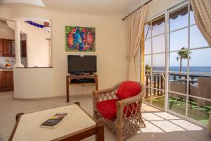 a living room with a view of the ocean at Altamar 53 balcony sea views By CanariasGetaway in Playa del Aguila