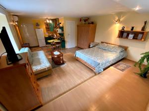 Postel nebo postele na pokoji v ubytování Apartamentai Nidoje