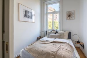 Postel nebo postele na pokoji v ubytování Goger Apartman