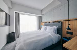 ibis Styles Nagoya房間的床