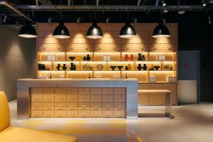 a store with a counter and some lights and shelves at ibis Styles Nagoya in Nagoya