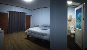 Postel nebo postele na pokoji v ubytování หลับสบายที่ดอยตุง Zuh meh ja Home lodge