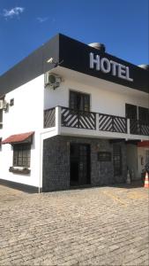 a hotel with a black and white building at Hotel Vandressen e Castro in Garuva