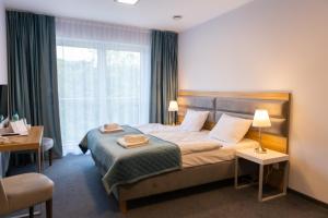 Posteľ alebo postele v izbe v ubytovaní Hotel i Apartamenty pod Śnieżnikiem