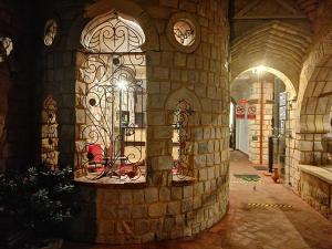 a stone wall with a gate in a building at Castillo de Tarapoto in Tarapoto